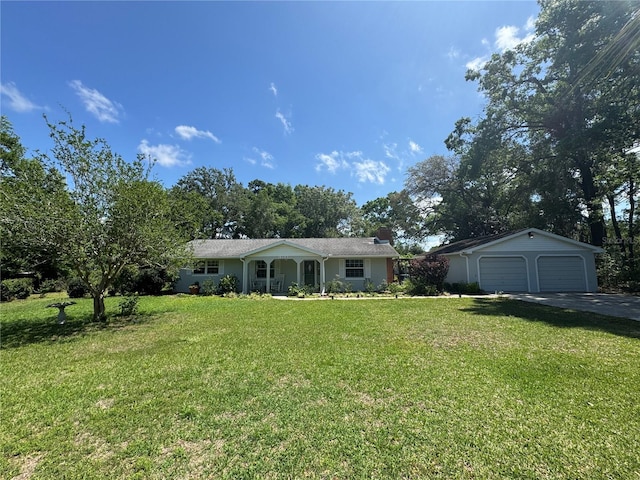 12015 SE 72nd Court Rd, Belleview, FL 34420 - ranch-style home with an outbuilding, driveway, a front lawn, and a chimney