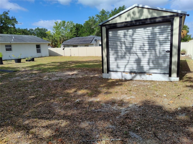 garage with fence