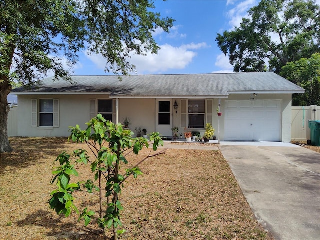 ranch-style home featuring a porch, a garage, stucco siding, and concrete driveway