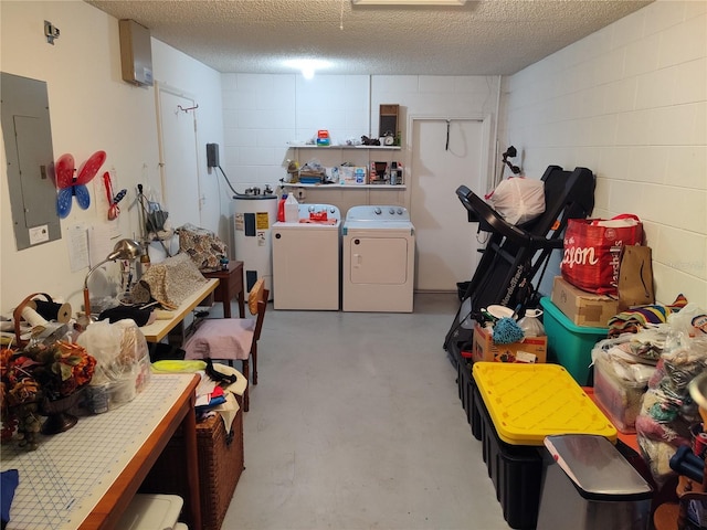 interior space featuring laundry area, electric panel, concrete block wall, water heater, and separate washer and dryer