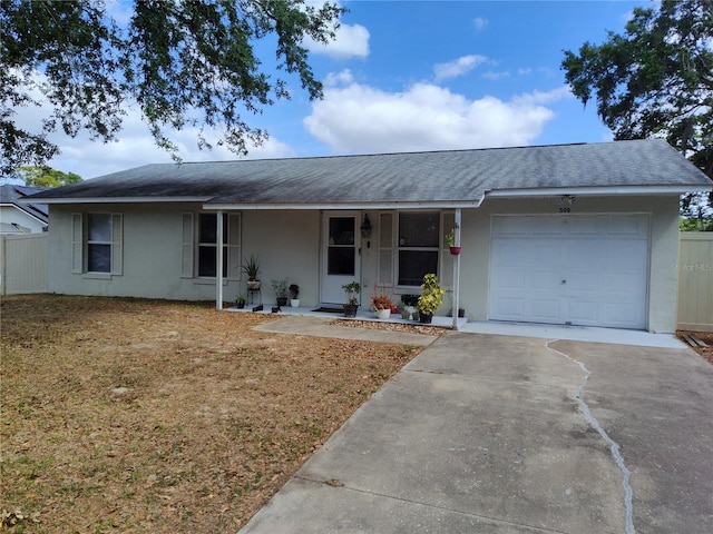 ranch-style home with a porch, roof with shingles, a garage, concrete driveway, and stucco siding