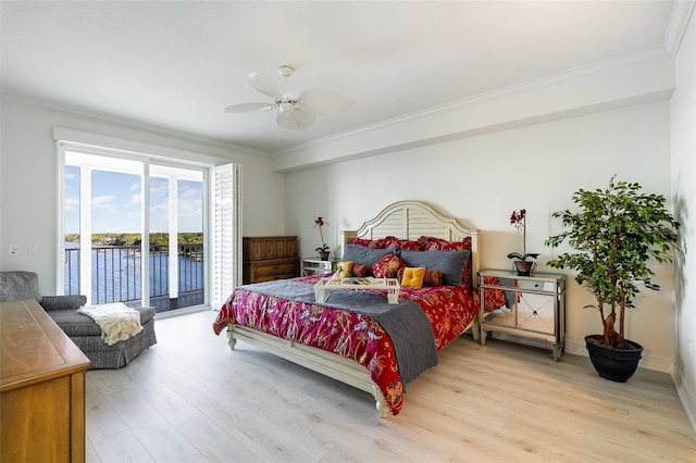 490 Sail Ln Unit 702, Merritt Island, FL 32953 - bedroom with light wood-type flooring, ornamental molding, a water view, access to exterior, and ceiling fan