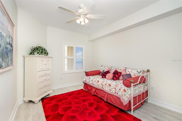 490 Sail Ln Unit 702, Merritt Island, FL 32953 - bedroom with baseboards, light wood-style flooring, and a ceiling fan
