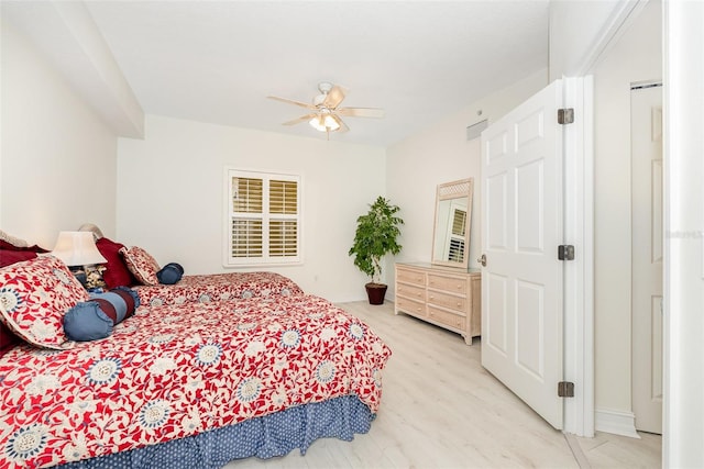 490 Sail Ln Unit 702, Merritt Island, FL 32953 - bedroom with baseboards, light wood-style floors, and a ceiling fan