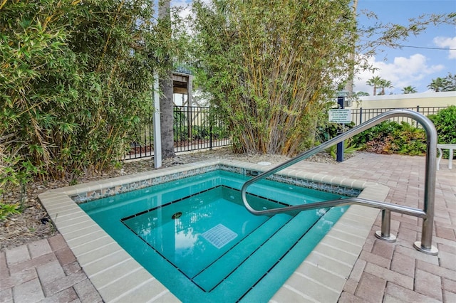 490 Sail Ln Unit 702, Merritt Island, FL 32953 - view of swimming pool with a community hot tub, fence, and a patio