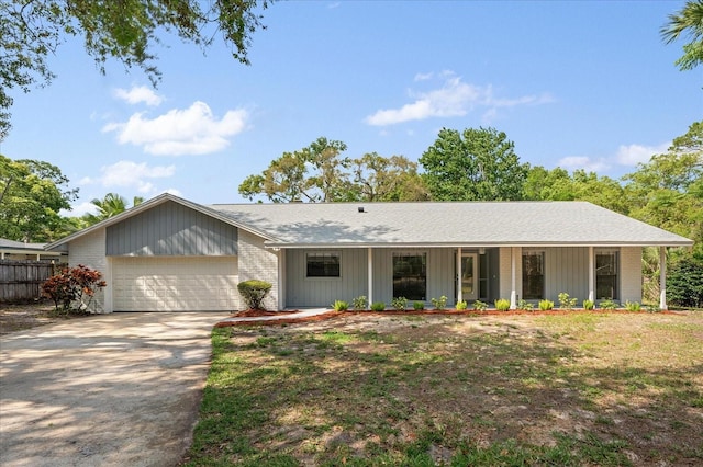 345 W Hornbeam Dr, Longwood, FL 32779 - single story home with fence, brick siding, a garage, concrete driveway, and covered porch