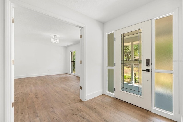 345 W Hornbeam Dr, Longwood, FL 32779 - doorway featuring baseboards and wood finished floors