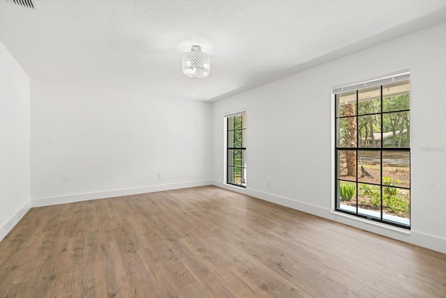 345 W Hornbeam Dr, Longwood, FL 32779 - unfurnished room with baseboards, wood finished floors, and visible vents