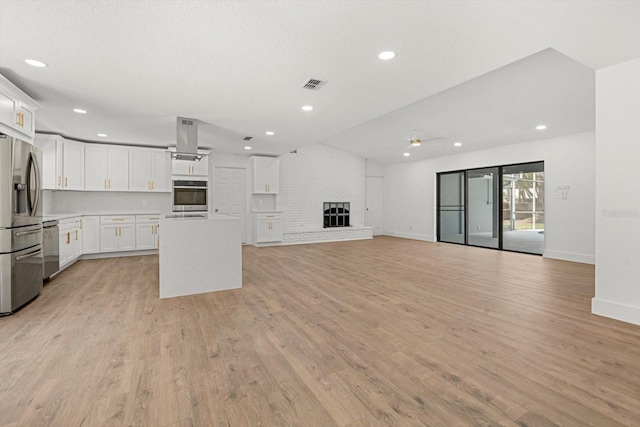 345 W Hornbeam Dr, Longwood, FL 32779 - unfurnished living room with visible vents, recessed lighting, light wood-style flooring, and ceiling fan