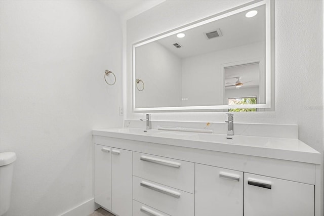 345 W Hornbeam Dr, Longwood, FL 32779 - bathroom with ceiling fan, double vanity, toilet, recessed lighting, and visible vents