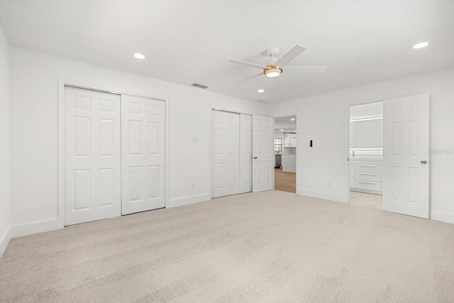 345 W Hornbeam Dr, Longwood, FL 32779 - unfurnished bedroom featuring visible vents, light colored carpet, baseboards, multiple closets, and recessed lighting