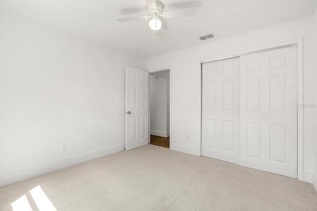 345 W Hornbeam Dr, Longwood, FL 32779 - unfurnished bedroom featuring visible vents, a closet, baseboards, ceiling fan, and carpet flooring