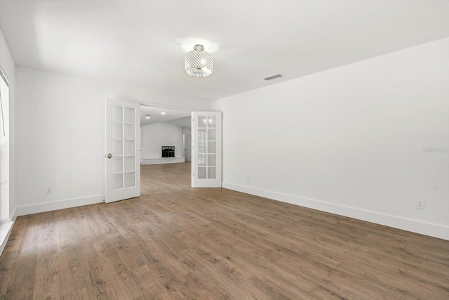 345 W Hornbeam Dr, Longwood, FL 32779 - interior space featuring baseboards, visible vents, french doors, and wood finished floors
