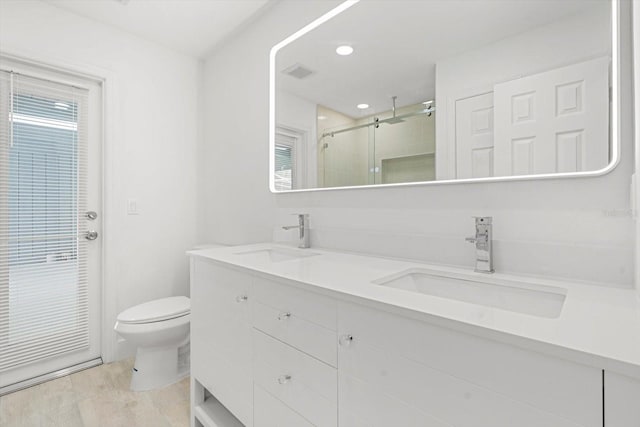 345 W Hornbeam Dr, Longwood, FL 32779 - full bath with a sink, a stall shower, toilet, and double vanity