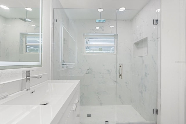 345 W Hornbeam Dr, Longwood, FL 32779 - full bathroom featuring a marble finish shower, vanity, and tile walls