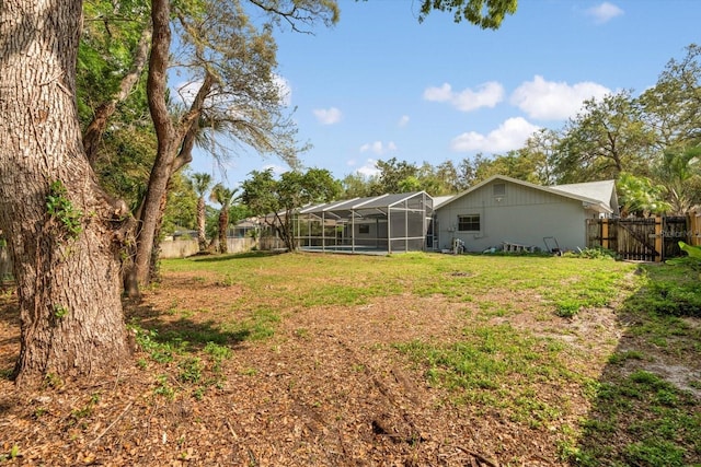 345 W Hornbeam Dr, Longwood, FL 32779 - view of yard with a fenced backyard, a gate, glass enclosure, and a pool