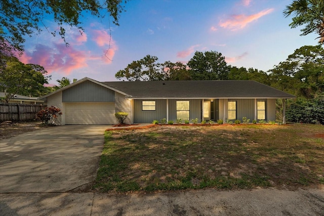 345 W Hornbeam Dr, Longwood, FL 32779 - view of front of home featuring a garage, fence, and driveway