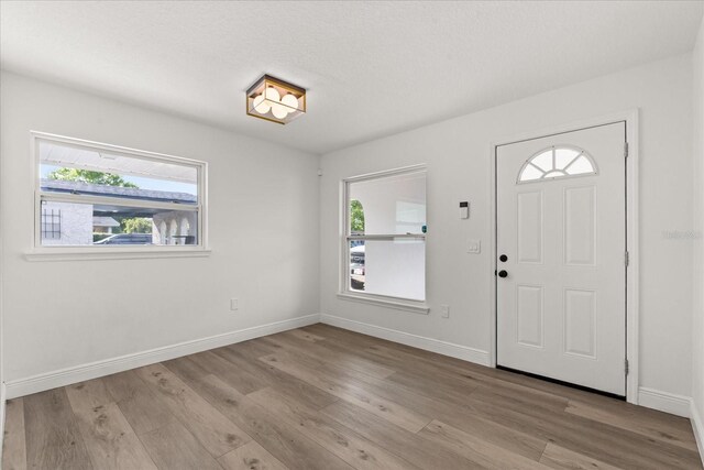 4246 Clarinda St, Orlando, FL 32811 - foyer with baseboards and wood finished floors