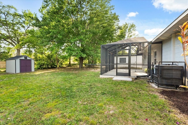 4246 Clarinda St, Orlando, FL 32811 - view of yard featuring a shed, a lanai, an outbuilding, and central AC