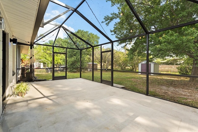 4246 Clarinda St, Orlando, FL 32811 - view of patio / terrace featuring a storage unit, an outdoor structure, and a lanai