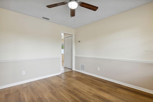 3994 Irma Shores Dr, Orlando, FL 32817 - spare room featuring baseboards, visible vents, wood finished floors, and a ceiling fan