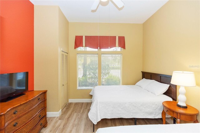 8100 Poinciana Blvd Unit 2109, Orlando, FL 32821 - bedroom featuring a ceiling fan, a closet, baseboards, and light wood finished floors