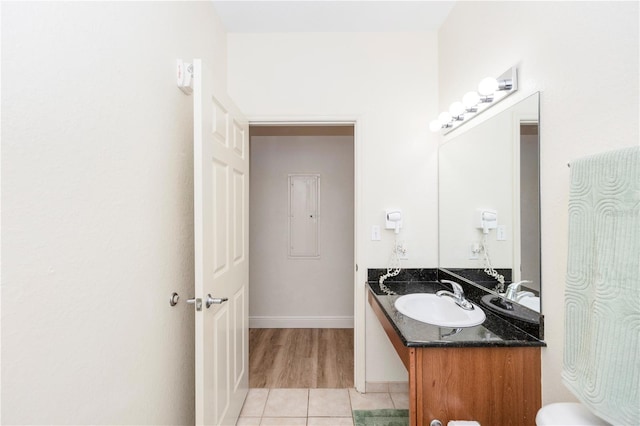 8100 Poinciana Blvd Unit 2109, Orlando, FL 32821 - half bathroom with baseboards, toilet, tile patterned floors, and vanity