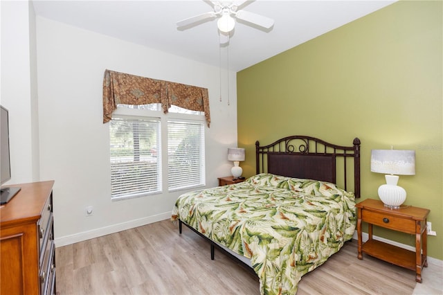 8100 Poinciana Blvd Unit 2109, Orlando, FL 32821 - bedroom featuring baseboards, light wood-style flooring, and a ceiling fan