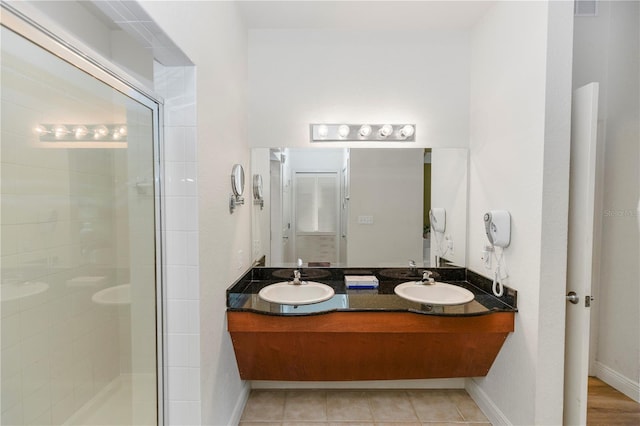 8100 Poinciana Blvd Unit 2109, Orlando, FL 32821 - bathroom featuring a shower stall, tile patterned floors, baseboards, and a sink