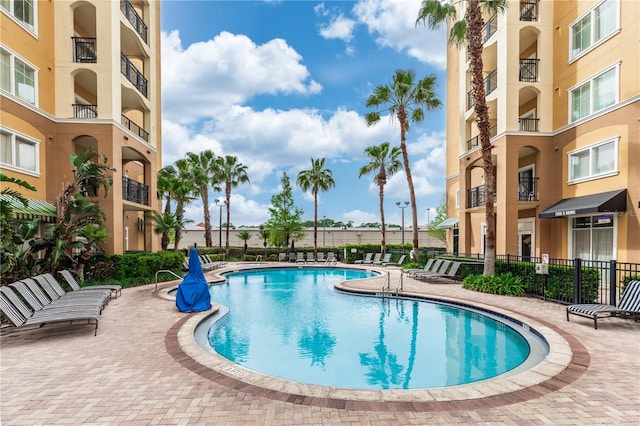 8100 Poinciana Blvd Unit 2109, Orlando, FL 32821 - community pool with fence and a patio