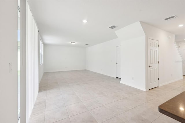 4705 Jasmine Cir, Leesburg, FL 34748 - empty room featuring light tile patterned floors, recessed lighting, and baseboards