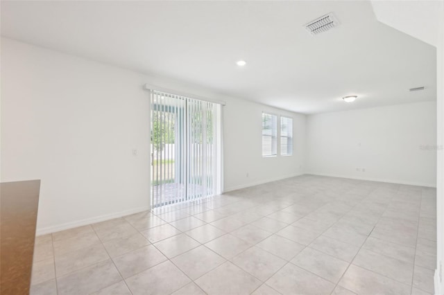 4705 Jasmine Cir, Leesburg, FL 34748 - empty room featuring light tile patterned floors, baseboards, and recessed lighting