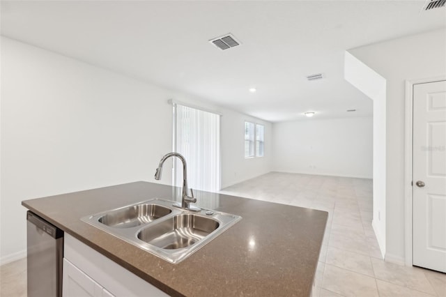 4705 Jasmine Cir, Leesburg, FL 34748 - kitchen with a sink, dark countertops, dishwasher, white cabinets, and open floor plan