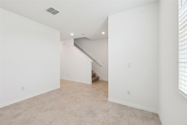 4705 Jasmine Cir, Leesburg, FL 34748 - empty room with recessed lighting, stairway, baseboards, and light tile patterned floors