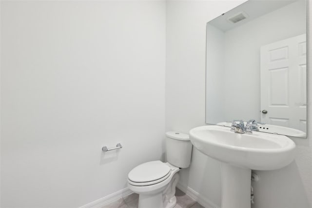 4705 Jasmine Cir, Leesburg, FL 34748 - bathroom with baseboards, toilet, tile patterned floors, and a sink