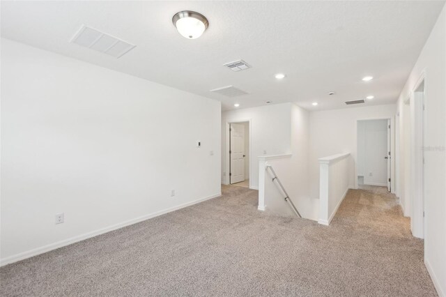 4705 Jasmine Cir, Leesburg, FL 34748 - spare room featuring light carpet, recessed lighting, and baseboards