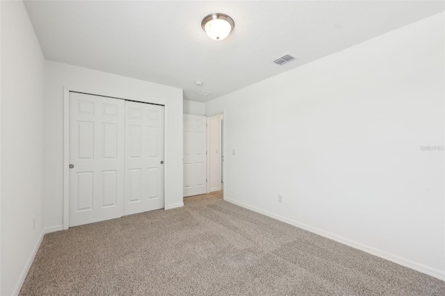 4705 Jasmine Cir, Leesburg, FL 34748 - unfurnished bedroom featuring carpet floors, baseboards, and a closet