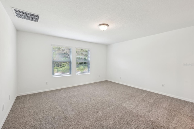 4705 Jasmine Cir, Leesburg, FL 34748 - unfurnished room with carpet, baseboards, and a textured ceiling