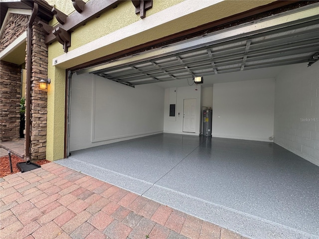 191 Chickasaw Berry Rd, Ocoee, FL 34761 - garage with electric water heater, a garage door opener, and electric panel