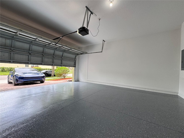 191 Chickasaw Berry Rd, Ocoee, FL 34761 - garage with a garage door opener and baseboards