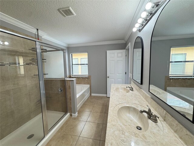 191 Chickasaw Berry Rd, Ocoee, FL 34761 - bathroom with a garden tub, double vanity, a stall shower, tile patterned flooring, and a textured ceiling