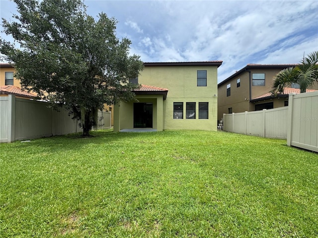191 Chickasaw Berry Rd, Ocoee, FL 34761 - back of house with stucco siding and a tile roof