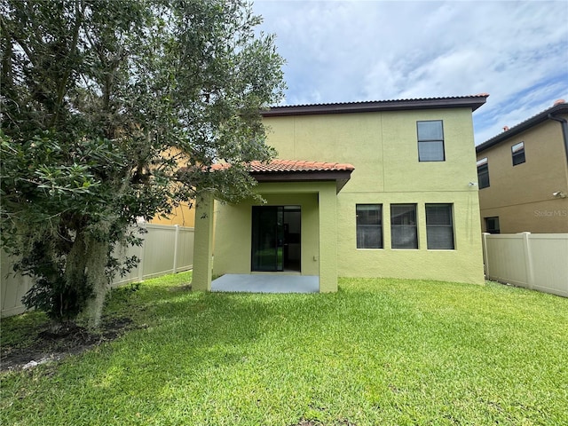 191 Chickasaw Berry Rd, Ocoee, FL 34761 - rear view of house with stucco siding and a tiled roof