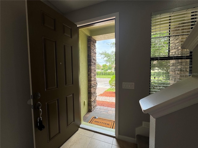 191 Chickasaw Berry Rd, Ocoee, FL 34761 - foyer featuring light tile patterned floors and baseboards