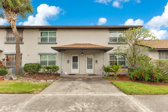 5763 Saint Christopher Dr Unit 55, Orlando, FL 32822 - view of front of house with stucco siding