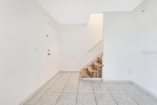 5763 Saint Christopher Dr Unit 55, Orlando, FL 32822 - stairs featuring tile patterned flooring and baseboards