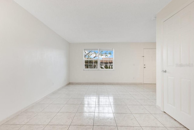 5763 Saint Christopher Dr Unit 55, Orlando, FL 32822 - unfurnished room with light tile patterned flooring and baseboards
