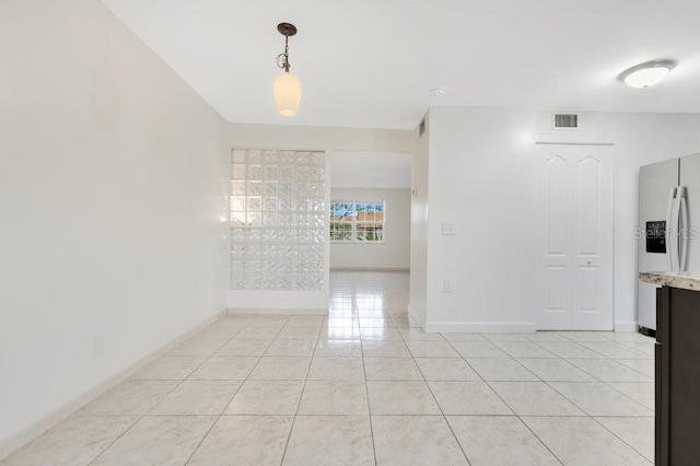 5763 Saint Christopher Dr Unit 55, Orlando, FL 32822 - unfurnished room with visible vents, baseboards, and light tile patterned flooring