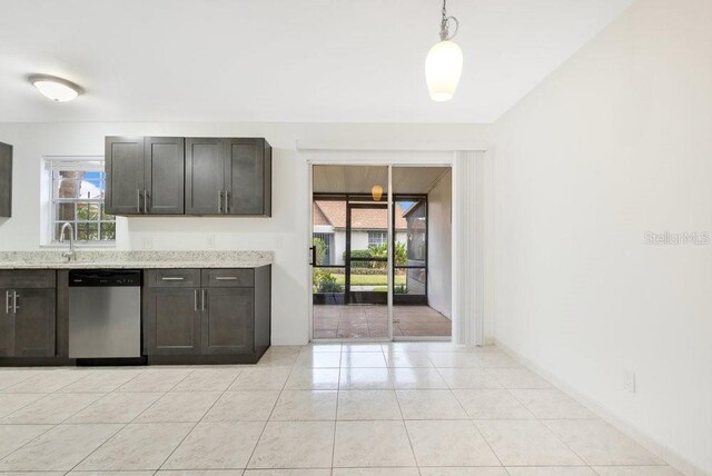 5763 Saint Christopher Dr Unit 55, Orlando, FL 32822 - kitchen featuring pendant lighting, stainless steel dishwasher, light stone counters, light tile patterned flooring, and a sink