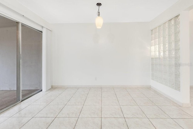 5763 Saint Christopher Dr Unit 55, Orlando, FL 32822 - interior space with baseboards and light tile patterned flooring